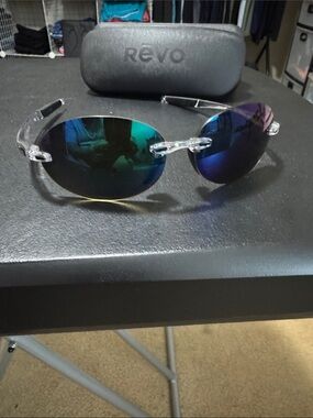 Revo Rimless Sunglasses with Clear Frame and Blue-Green Mirrored Lenses